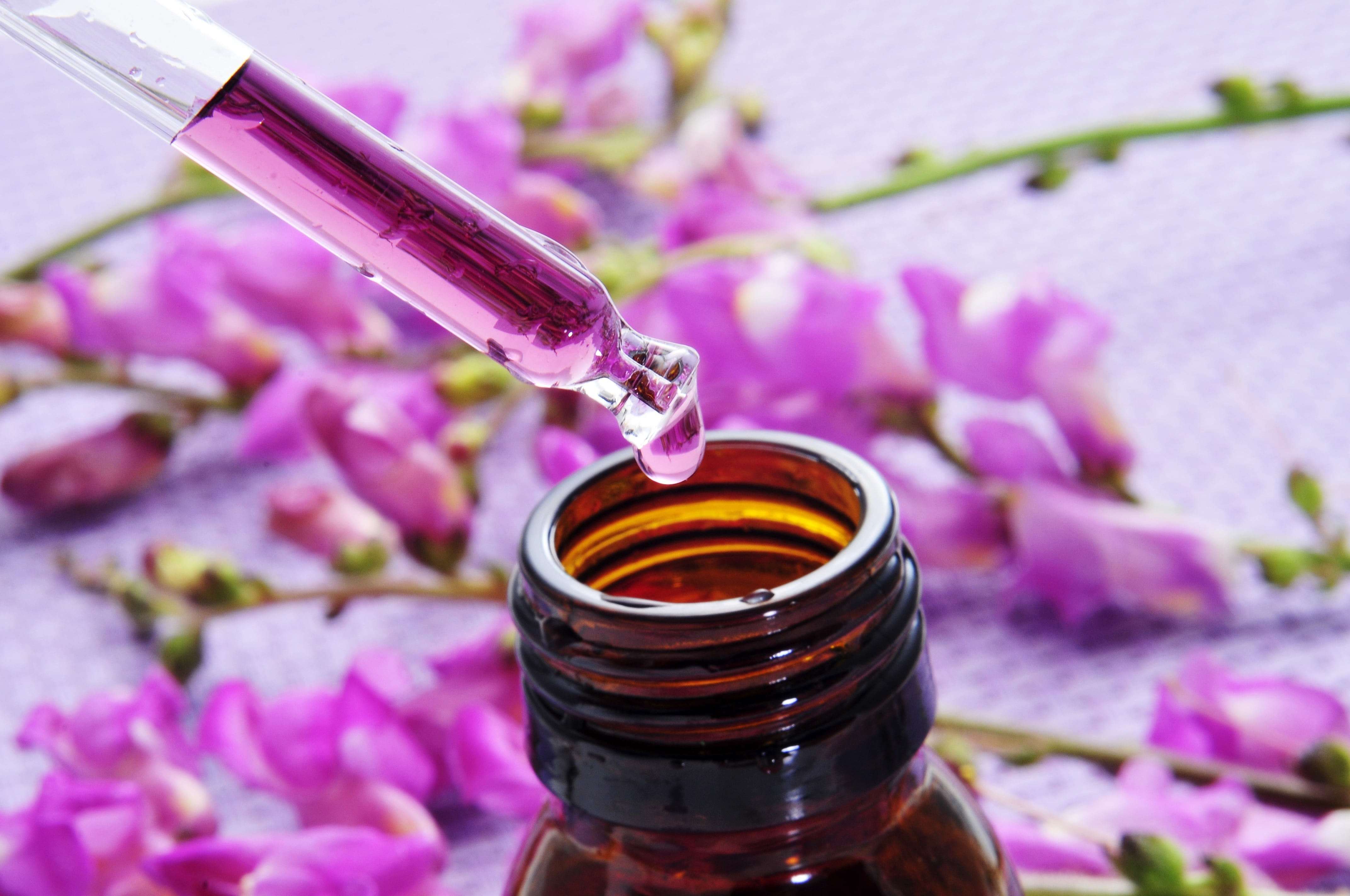 pink orchid essential oil close up dropper bottle_20610647_l