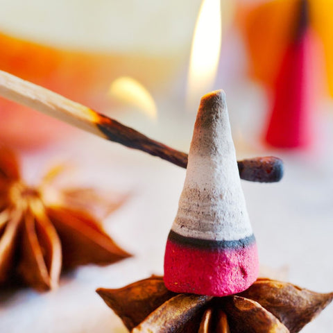 lighting a cone incense