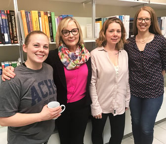 ACHS Founding President Dorene Petersen with three students