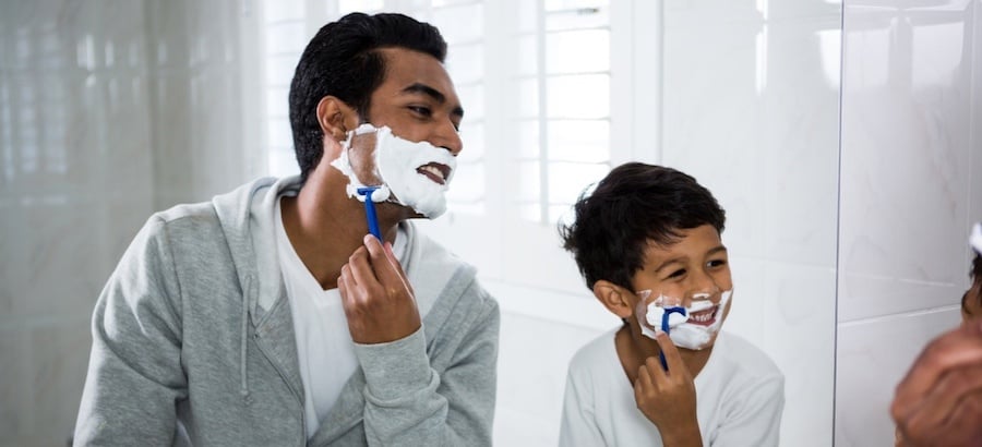 Father and son shaving