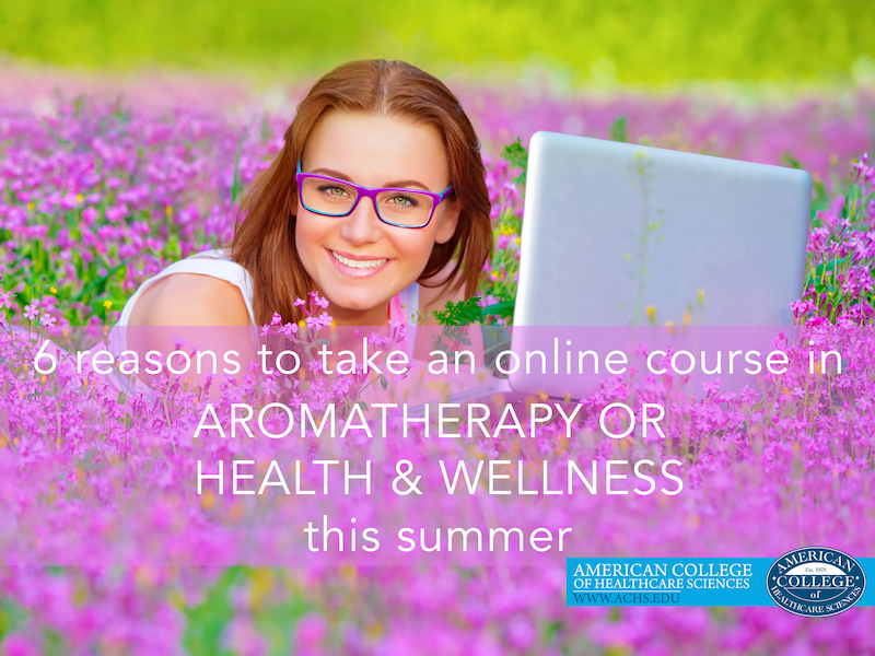 a woman sitting in a field of purple flowers wears glasses and smiles at the camera