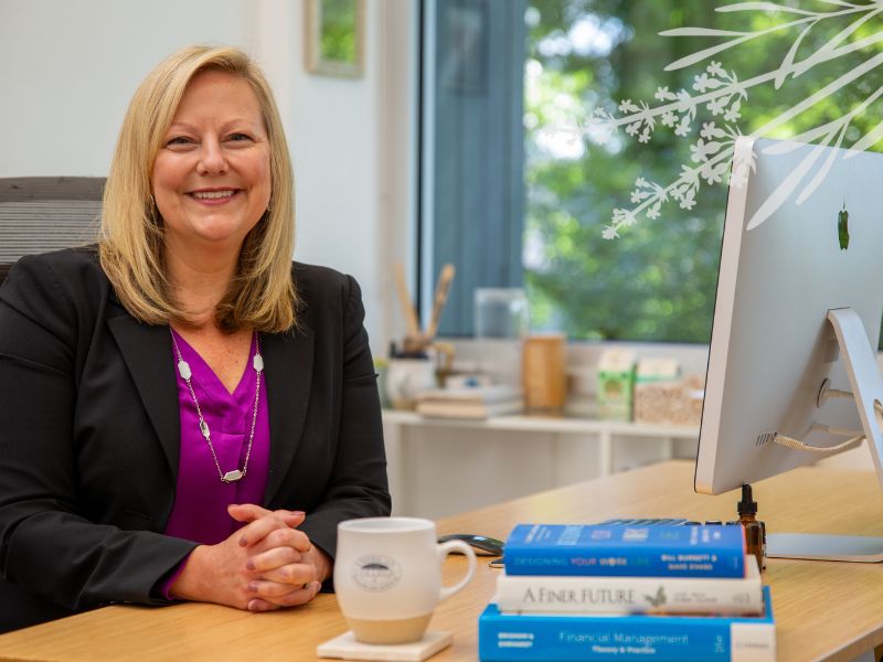 ACHS President Tracey Abell sits at her desk on campus
