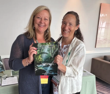 Pictured here, Hawthorn University graduate Amy Wing, who worked with ACHS through its teachout partnership with Hawthorn University, proudly shares her newly published book, Natural Foods from the Tapestry of Life.