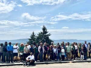 ACHS graduates, their families, and friends pose for a group photo at Mt. Tabor Park with ACHS leadership