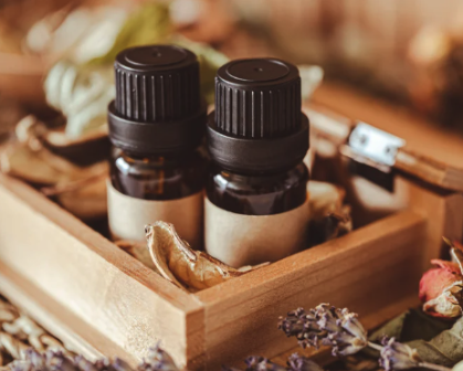 Two bottle sof essential oil in a wooden box