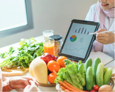 A nutritionist showing a chart to a client