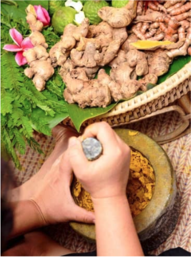 a person grinding herbs with a mortar and pestle