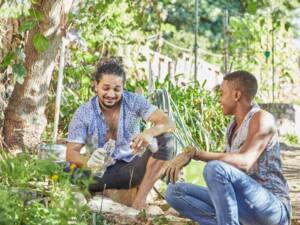 Two people working in a community garden