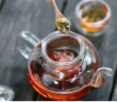 homemade herbal tea in a glass pot