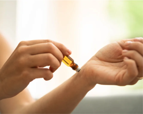 someone using an aromatherapy roller