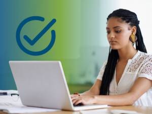 A woman working at a laptop