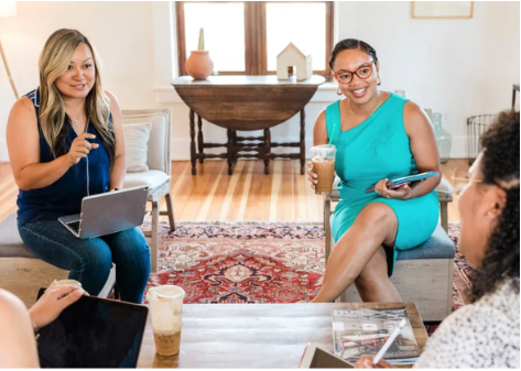 A group of women talking in a circle