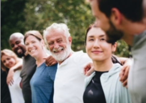 A group of people with their arms around each other
