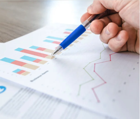 A paper with graphs and a pen