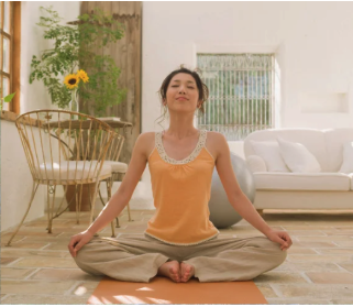 A woman doing yoga in her house