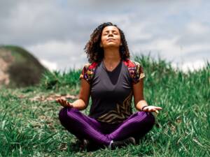 A woman meditating outside