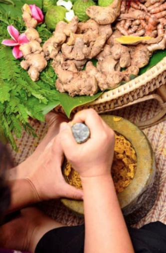 grinding dried herbs with a mortar and pestle
