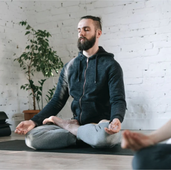 A man meditating cross-legged