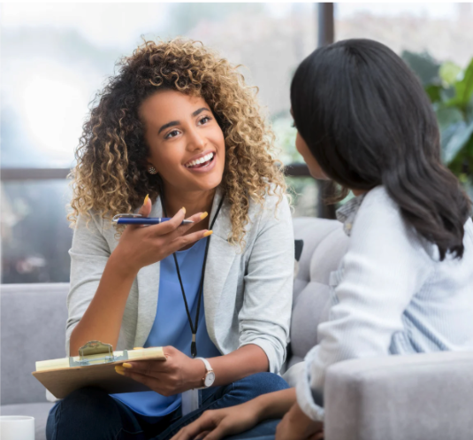 A wellness coach talking to a client