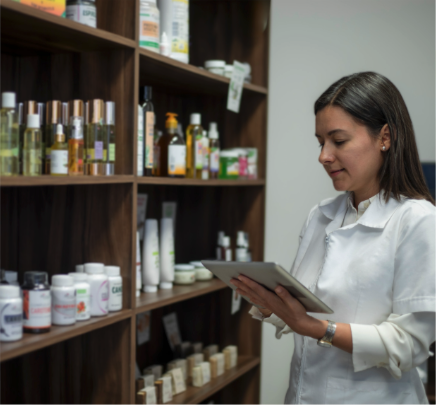 A woman working on an iPad in a wellness shop
