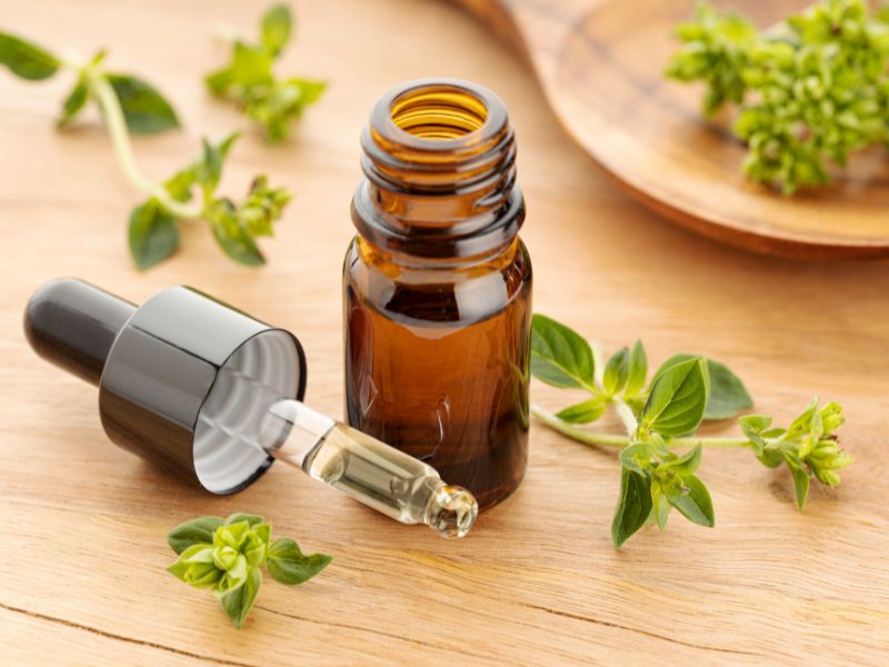 a bottle of essential oil with a dropper