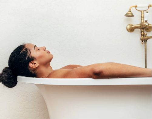 A woman relaxing in a bathtub