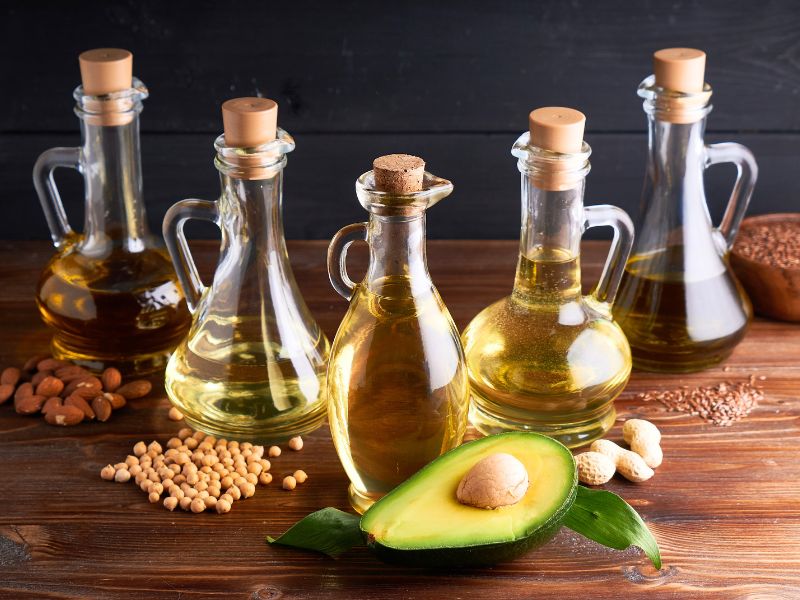 An assortment or carrier oils in glass bottles