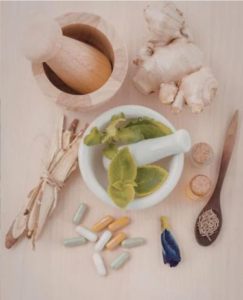 2. A wooden table filled with an array of herbs and spices, highlighting their diverse shapes and rich colors.