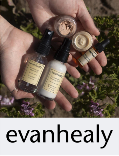 Hands holding evanhealy products