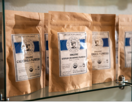 Brown packages of organic herbs on a shelf