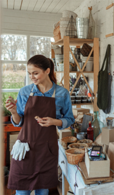 An herbalist wearing an apron working in a shop