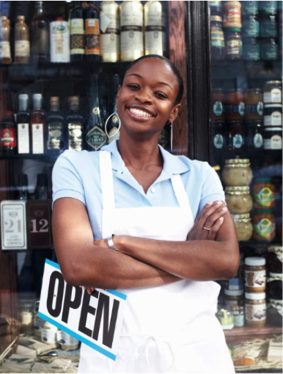 Woman holding open for business sign