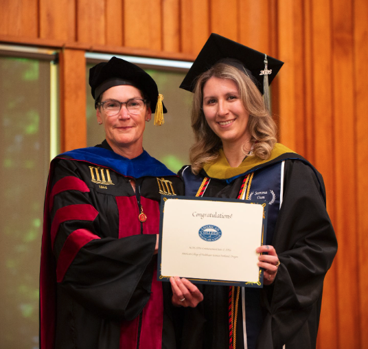 Patricia Kaufman and an ACHS graduate