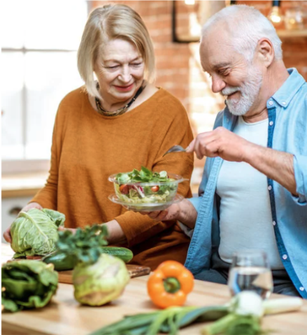 Older man and woman preparing food