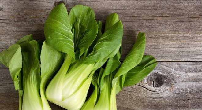 35287743 - overhead shot of chinese cabbage, bok choy, on rustic wood