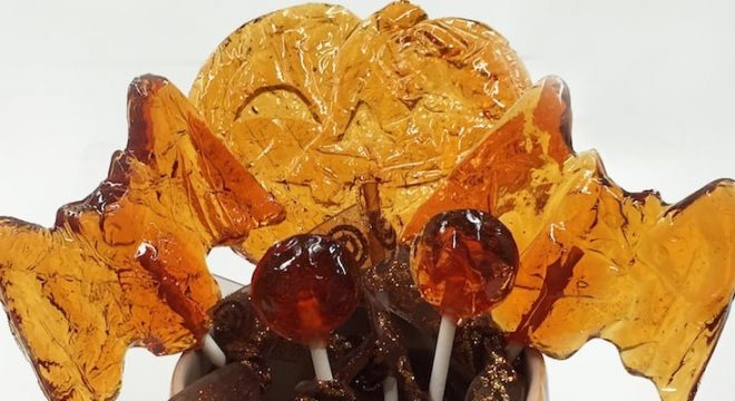 halloween-themed homemade lollipops are bunched together