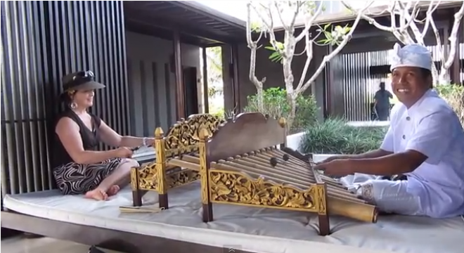 two people play xylophone-like instruments